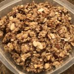 plastic storage container filled with homemade granola